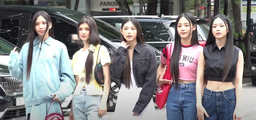 NewJeans arriving at Music Bank, 2022. This photograph shows the original five-member lineup.